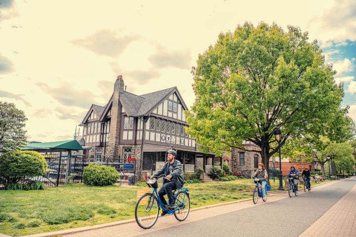 a person riding a bicycle down the street